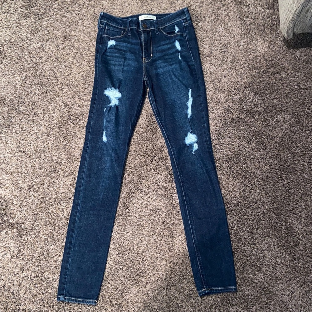 Dark blue holed jeans